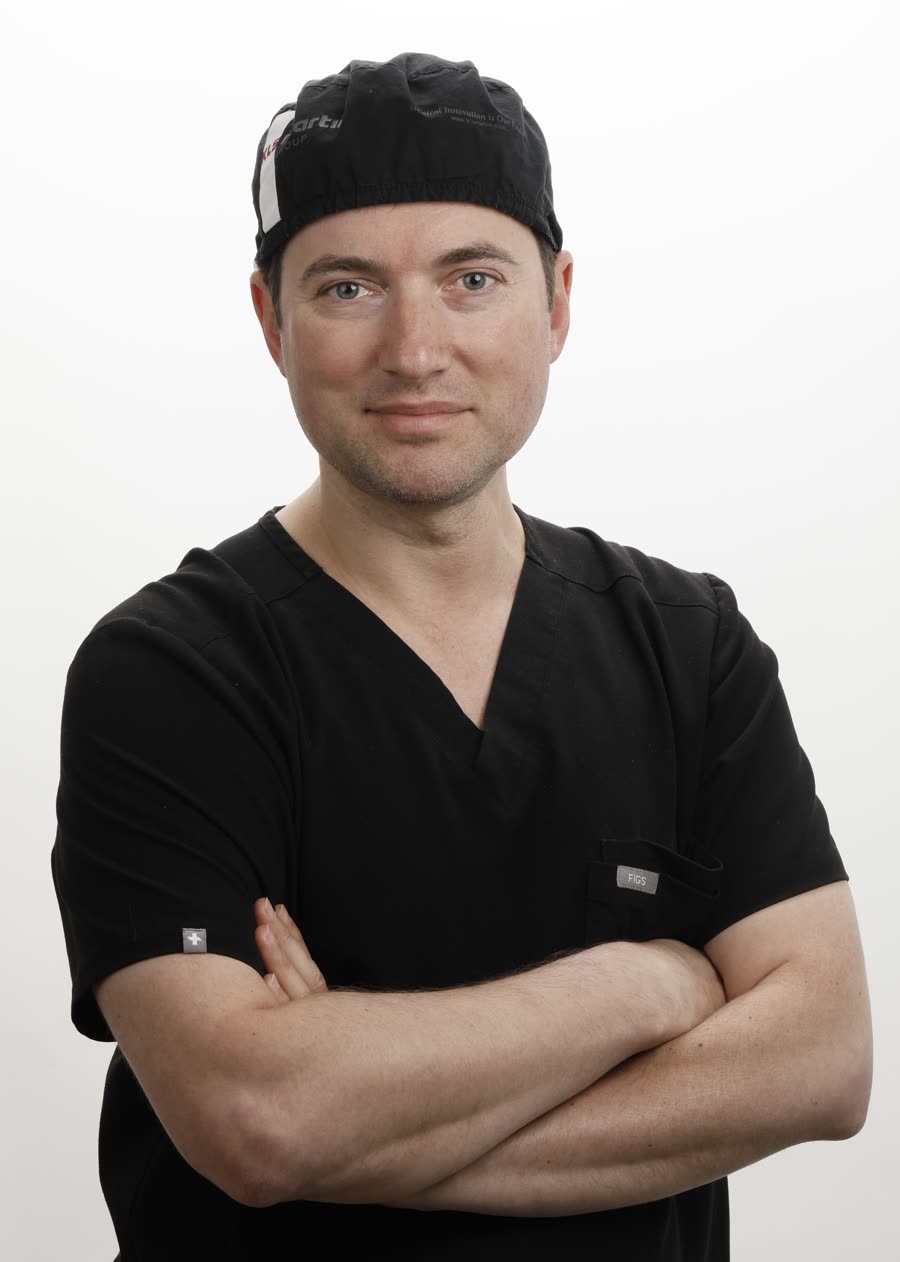 Dr. Alexander V. Antipov in surgical scrubs